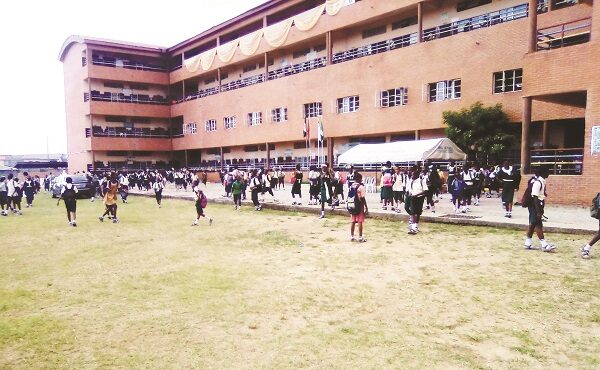 •Pupils of Gbagada Junior Comprehensive Secondary School leaving after school hours. Inset: The hand washing station.